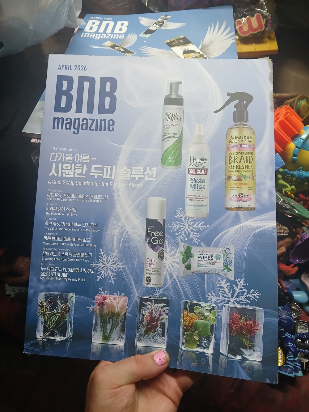 April 2026 cover of BNB Magazine, focusing on a cool scalp solution for the summ